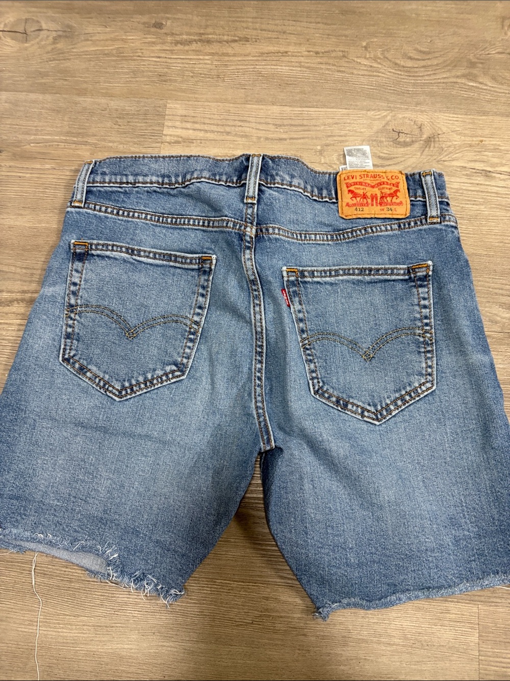Levi's 412 Light Blue Denim Frayed Hem Shorts size 34